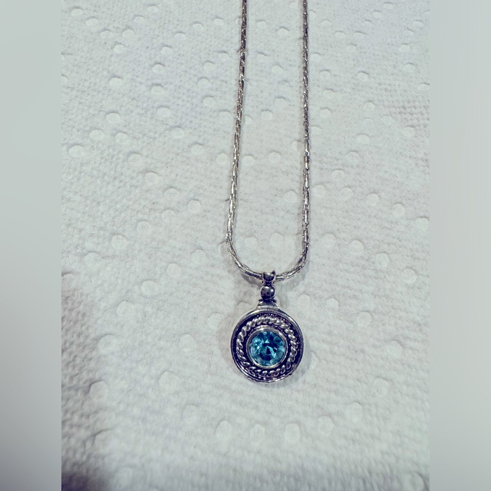 Sterling Silver necklace with a blue topaz pendant. Never Worn
